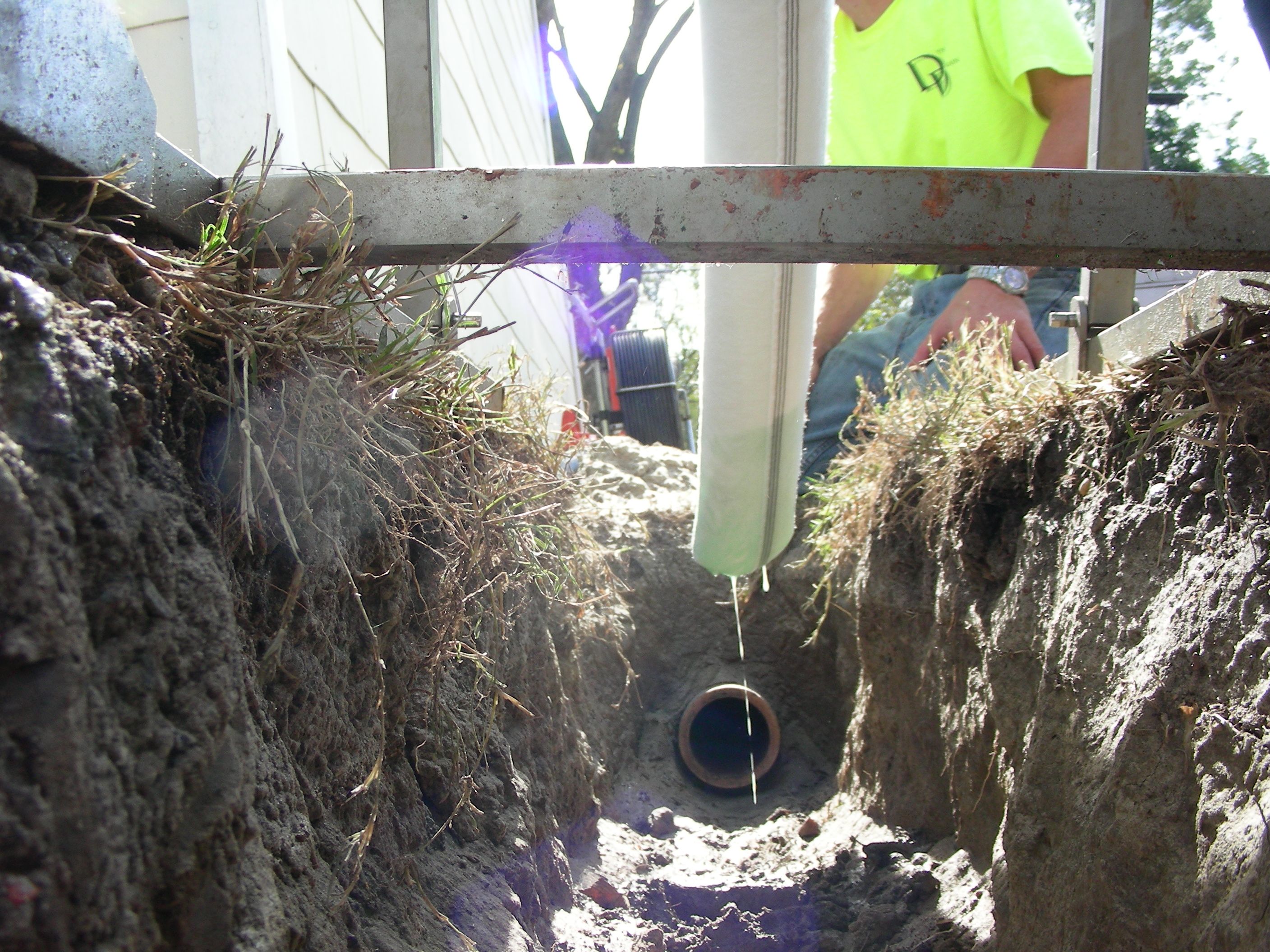 Trenchless liner being inverted into the access point which leads to the city's main