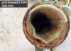 Old damaged pipes cut out by plumber